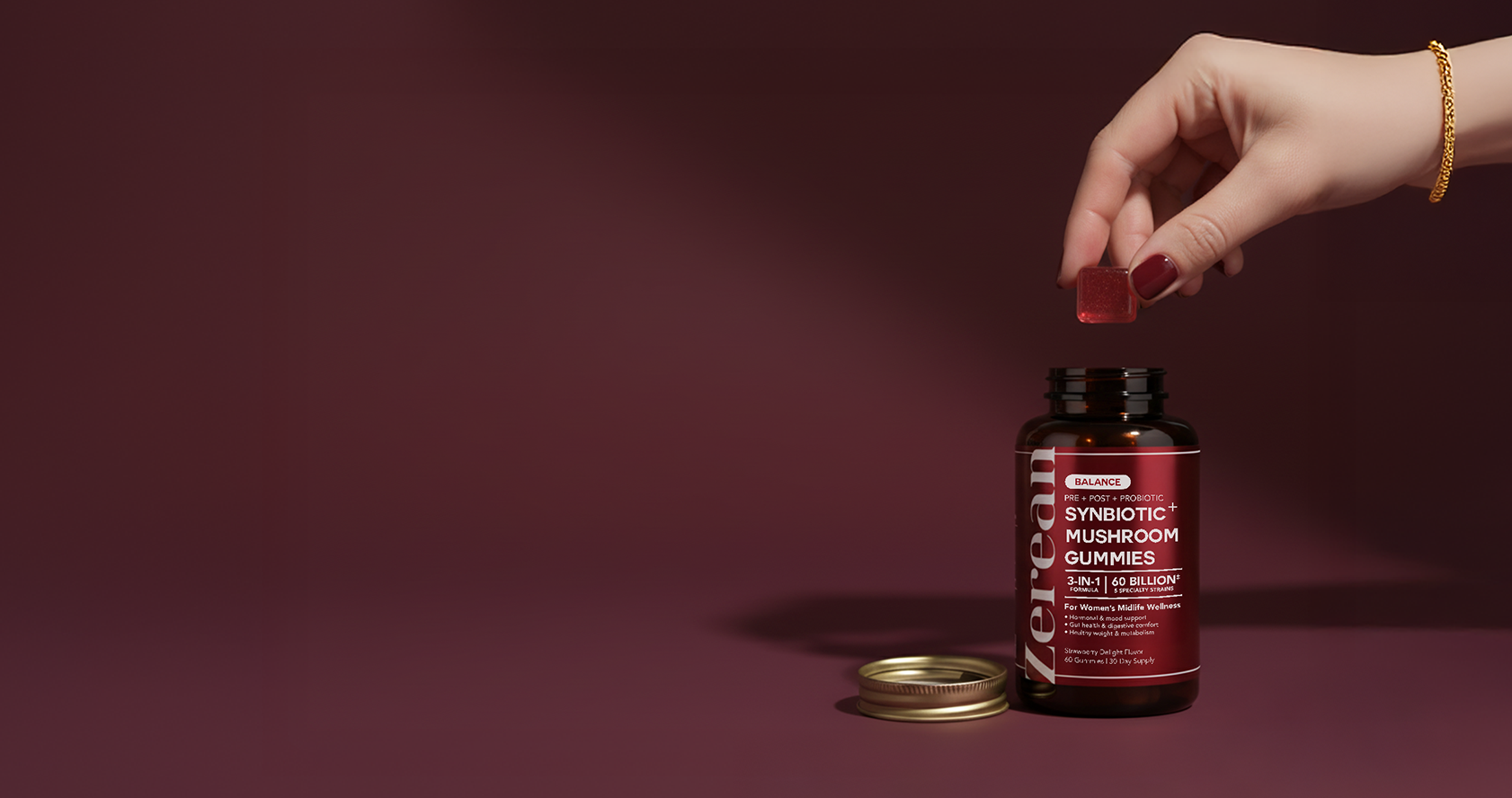 Woman holding a Zerean Balance Synbiotic + Mushroom Gummies bottle — world’s first 3-in-1 formula for gut and hormone balance during menopause